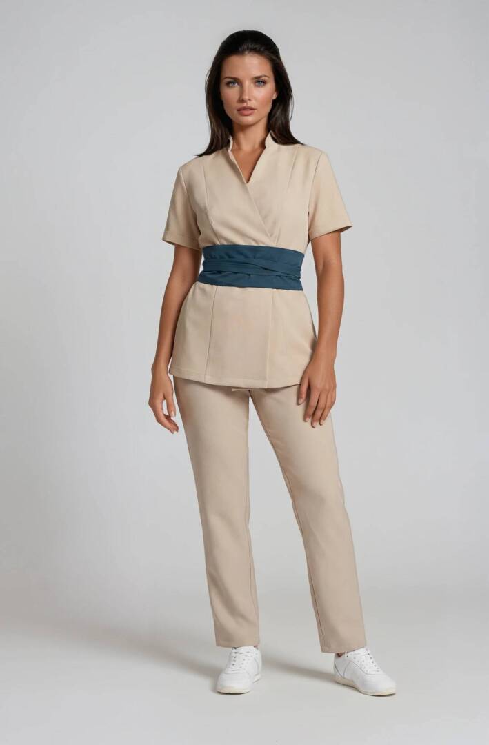 uniforma za salon Riviera luxury spa uniform in sand with turquoise satin wrap belt and straight-leg trousers