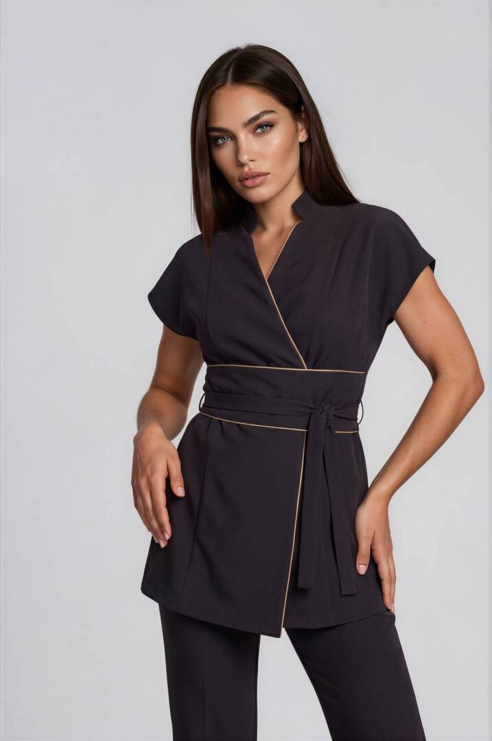 Premium Black Spa Tunic Luxury black spa tunic featuring elegant beige contrast piping and a wide wrap belt.