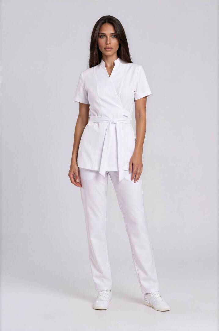 IMG_9309-Emmi-Light Studio-2 Luxury white spa uniform with wrap tunic, stand collar, waist tie belt and straight-leg trousers for beauty salons and aesthetic clinics.