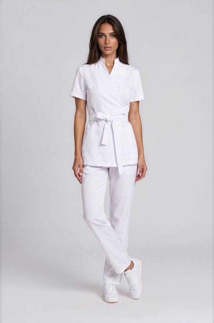 IMG_9309-Emmi-Light Studio-4 Front view of the Riviera White Wrap Set featuring an elegant wrap tunic with a stand collar and adjustable waist tie belt.