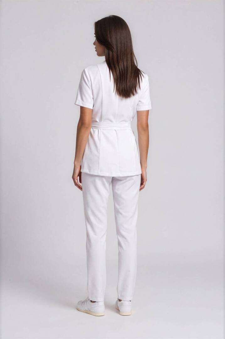 IMG_9309-Emmi-Light Studio Back view of the Riviera White professional spa uniform with clean tailored lines and straight-leg trousers.