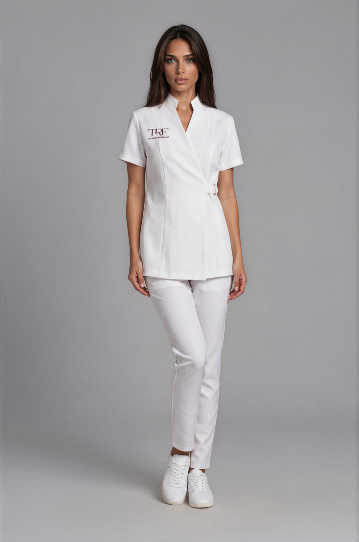 IMG_6413-Emmi-Medium Gray-3 Natural White Monaco spa uniform with embroidered wrap tunic, gold ring closure and tapered trousers