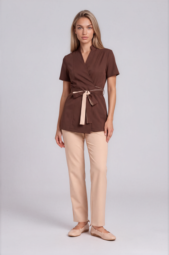 mocha brown and beige- Riviera Signature Mocha Brown and Beige spa uniform with wrap tunic, two-tone waist belt and straight beige trousers – front view